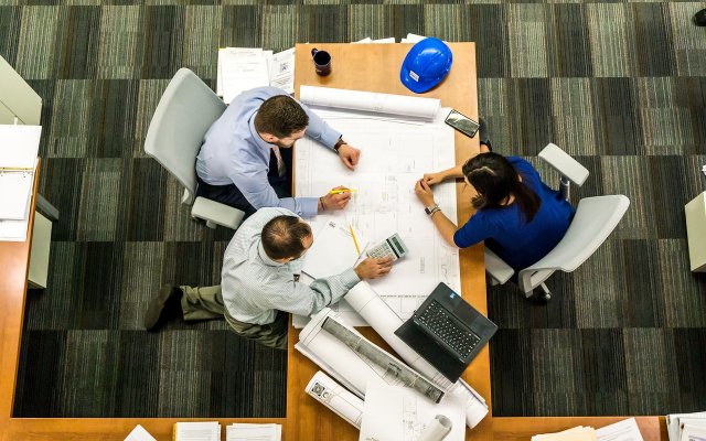 team members around a table in a meeting